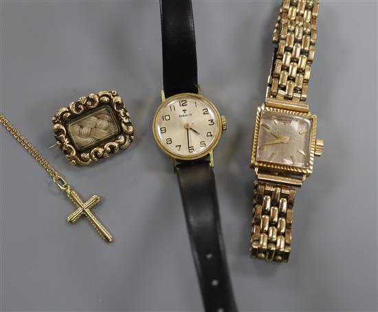 A Cortebert 18k 750 cased ladys wristwatch, a 375 cross pendant on fine chain, a pinchbeck mourning brooch and another watch.